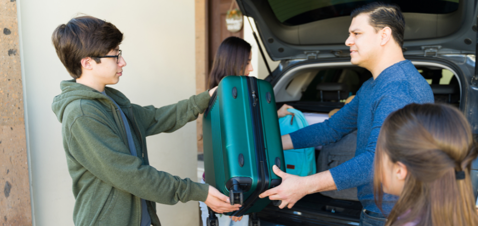 A family is seen packing their vehicle for a wildfire evacuation.  