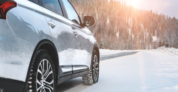 Modern SUV parked roadside on winter road