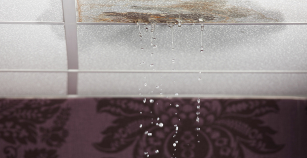 A close up image of water leaking through the roof of an RV. 