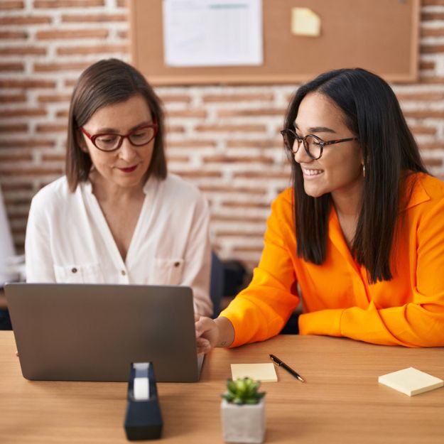 A woman reviewing her policy information with her insurance broker.