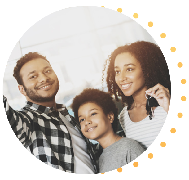 A family takes a selfie with the keys to their new car.