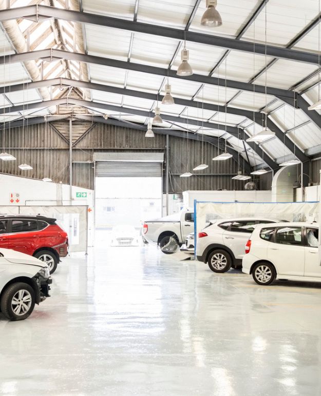 A commercial storage facility filled with cars.