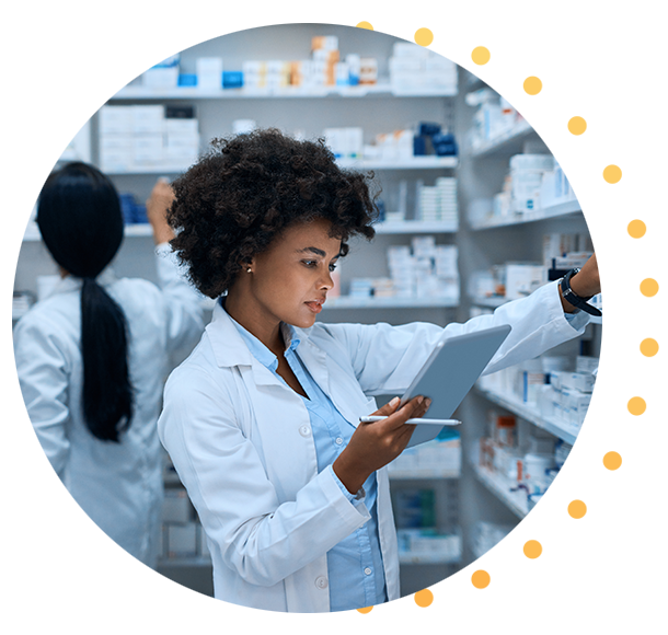 A pharmacist taking medication off the shelf to fill a prescription.