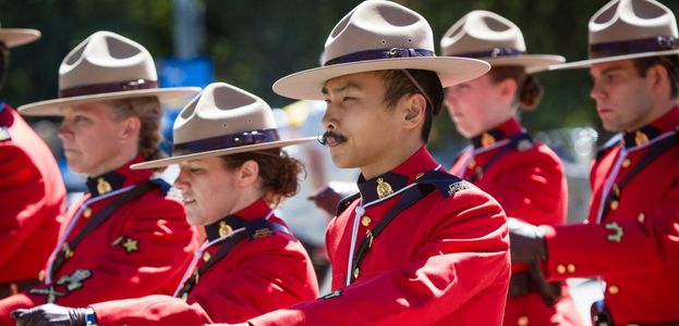 RCMP Officers marching in a parade.