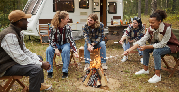 RV campers set up at a campground following RV camping etiquette, with trailers parked within designated spaces.  