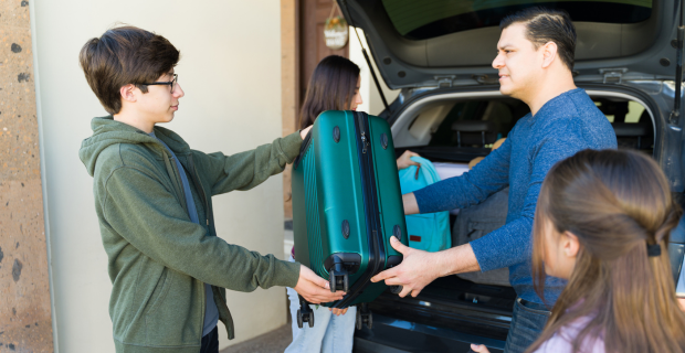 A family is seen packing their vehicle for a wildfire evacuation.  